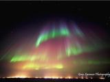 The Interior of Alaskan Life 7: Curtains of aurora borealis over a blanket of oilfield light